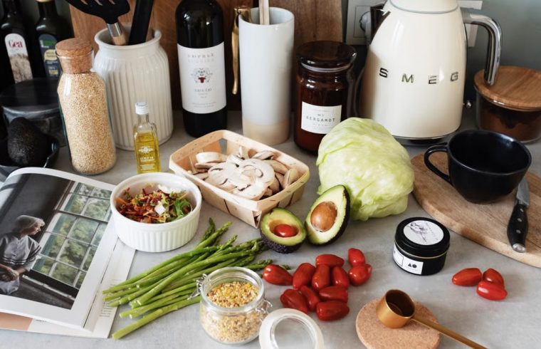 A variety of fresh ingredients and kitchen tools for preparing a healthy meal.